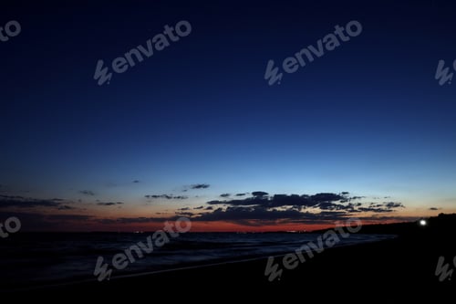Preview: Picturesque view of beautiful sunset on seaside at night