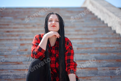 Preview: Portrait of a young woman with afro braids