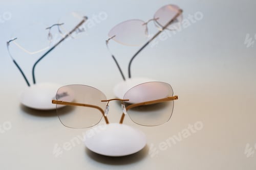 Preview: Stylish eyeglasses over background. Optical store, glasses selection, eye test