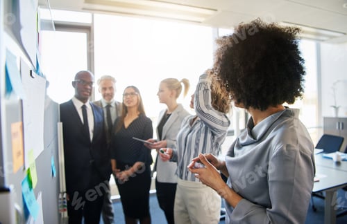 Preview: Diverse business team brainstorming in office