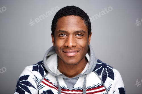 Preview: Close up smiling african man against gray background