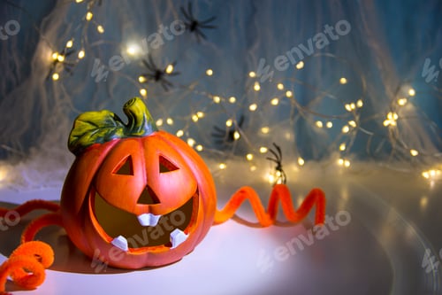 Preview: Pumpkin head and garlands. Halloween pumpkin head Jack lantern with burning candles
