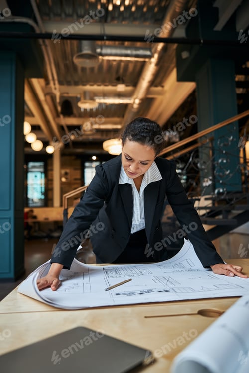Preview: Attentive young female staring at her drawing