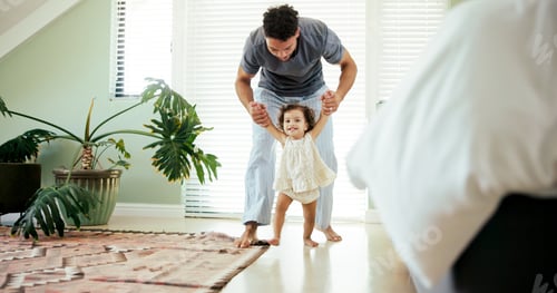 Preview: Father, child and learning to walk in home with holding hands, first steps and support with mobilit