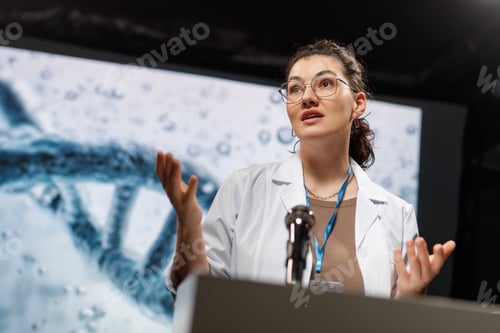 Preview: woman is giving a presentation at a conference