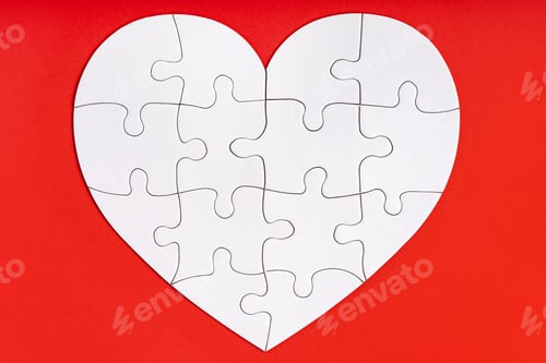 Preview: Jigsaw puzzle pieces in form of heart on red background. Love, charity, donation, helping concept