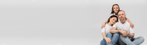 Preview: preteen girl hugging cheerful parents in white t-shirts and blue denim jeans while bonding together