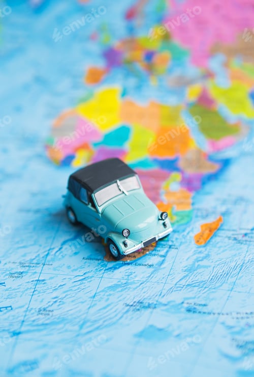 Preview: retro car on colorful world map, travel