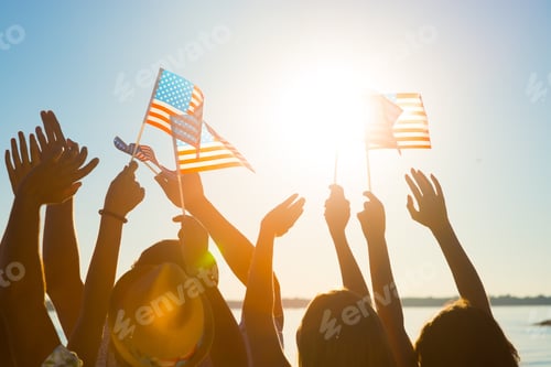 Preview: Crowd of waving American flags.