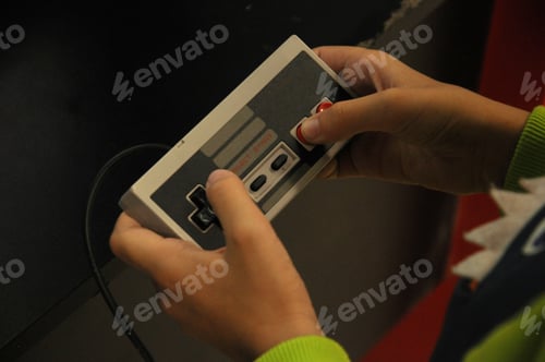 Preview: Using technology. Kid playing the game