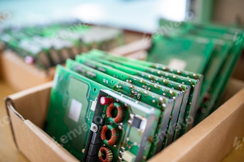 Preview: Green control chips of TFT monitors in cardboard box in shop