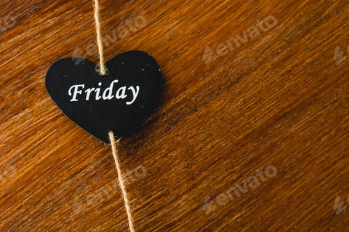 Preview: Black wooden heart with day of the week written on it, Friday