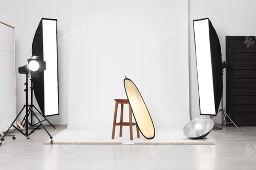 Preview: Stool with light reflector, professional lighting equipment and white background in photo studio