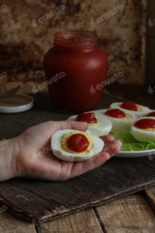 Preview: Boiled Eggs Cut And With Tomato Sauce