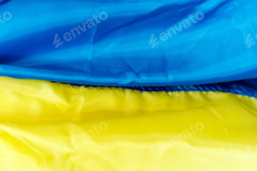Preview: Flag of Ukraine. Close up waving flag symbol of Ukraine. Martial law in Ukraine 2022