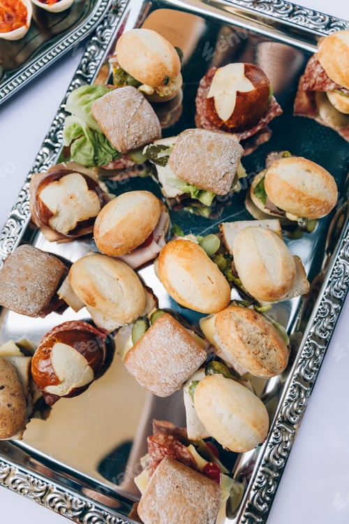 Preview: Mini sandwiches on a tray, view from above. Food catering buffet.