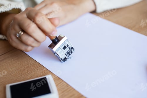 Preview: Hand Stamping Document on Desk: Legal, Approval, Office Setting