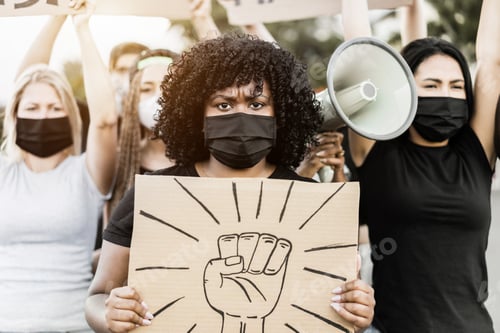 Preview: People from different culture and races protest on the street for equal rights - Focus on woman face