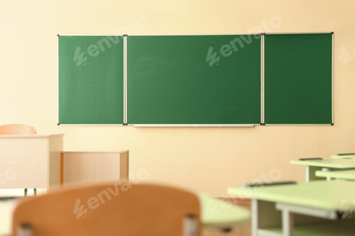 Preview: Green chalkboard on wall in classroom. Back to school