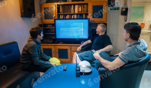 Preview: Happy team of ship officers watch TV onboard of vessel