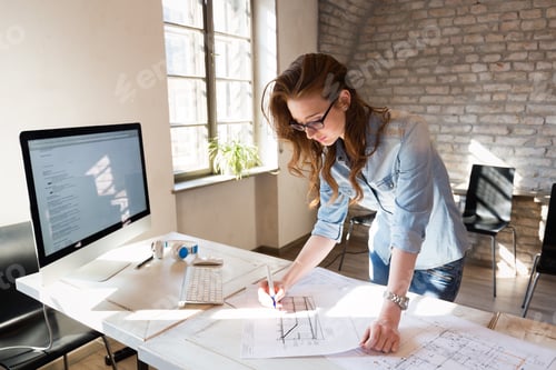 Preview: Picture of young architect working in office