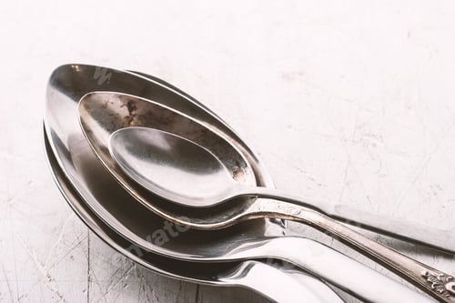 Preview: Set of metal spoon on the white table horizontal