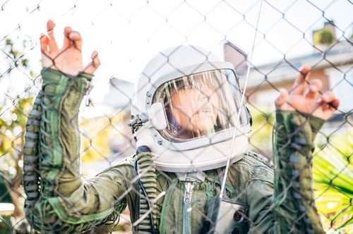 Preview: Adorable kid with a astronaut uniform playing in the street