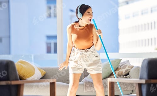 Preview: Karaoke, music and girl cleaning in the living room using a broom as a microphone singing a song on
