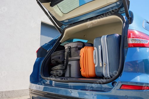Preview: Car trunk full of suitcases and travel bags ready for relocation or road trip