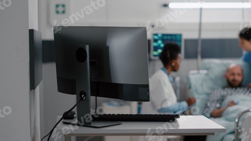 Preview: Afro american practitioner doctor discussing recovery treatment with sick man