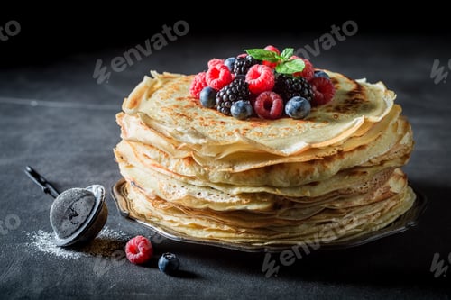 Preview: Big stack of pancakes with blueberries and raspberries