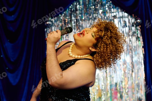 Preview: Captivating drag queen performance at a vibrant holiday show on stage