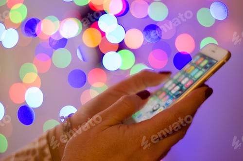 Preview: Hands with mobile phone on the multicolored bokeh background 💥nominated 💥