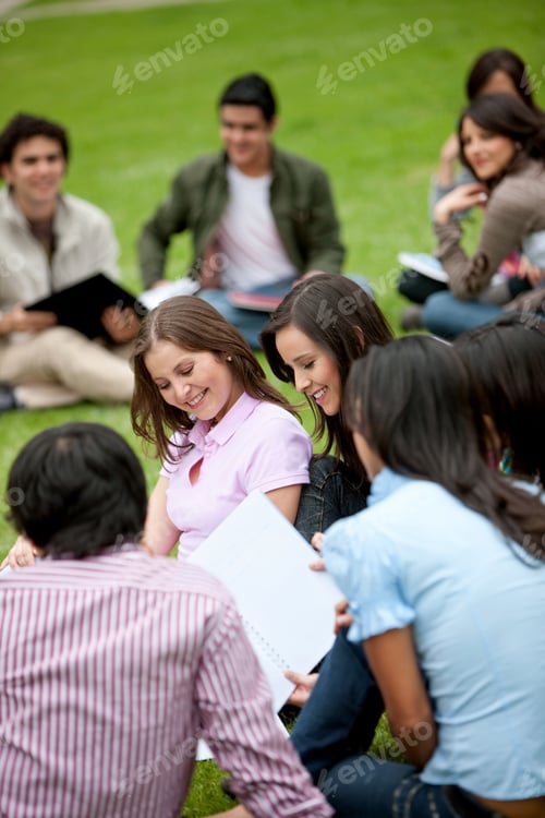 Preview: Group Of Students Sitting Outdoors And Smiling
