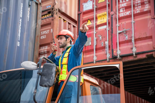 Preview: Male Container yard worker control and checking container.