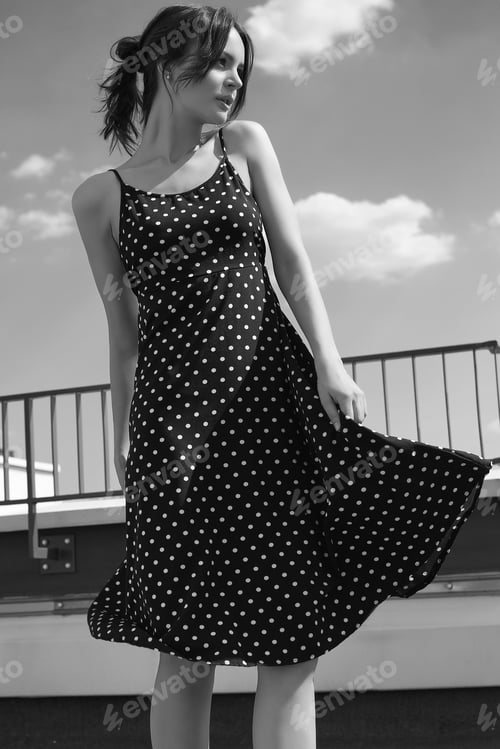 Preview: Portrait Of A Gorgeous Bright Brunette Woman In Fashion Dress Posing On The Roof Of A Building