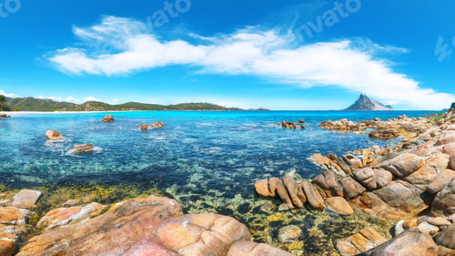 Preview: Superb azure water with rocks near beach Porto Taverna.