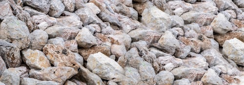 Preview: Rocky wall background texture. Close up view of stonewall, grey brown structure for backdrop. Banner