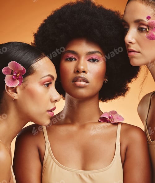 Preview: Flowers, beauty and portrait of women with makeup standing in a studio with an orange background. S
