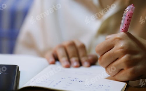 Preview: Hand writing on paper book blur background