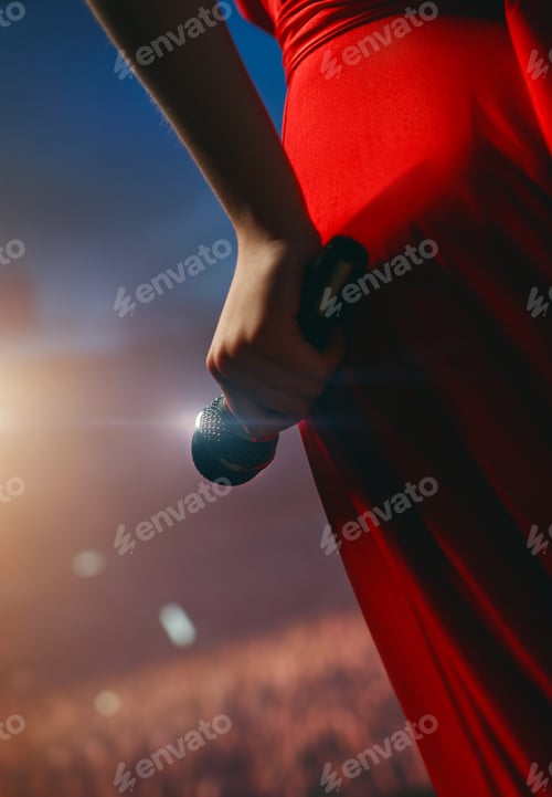 Preview: A singer on stage with a microphone