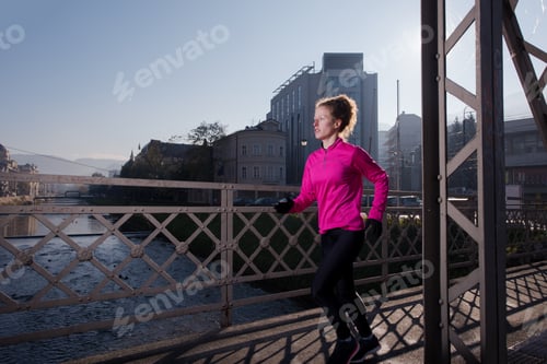 Preview: sporty woman jogging on morning