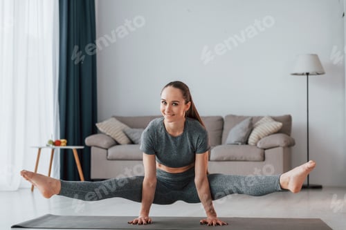 Preview: Exercises for stamina. Young woman with slim body type and in yoga clothes is at home
