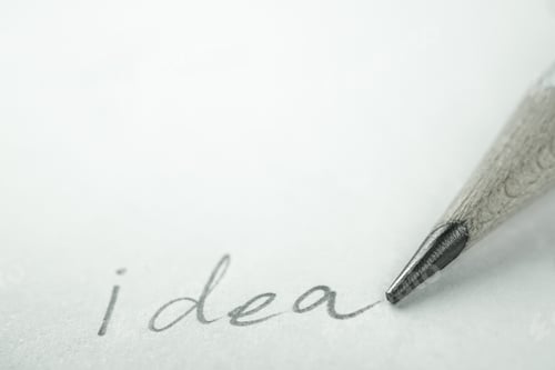 Preview: Writing "Ideas" Word With Pencil On The Paper For Idea Concept