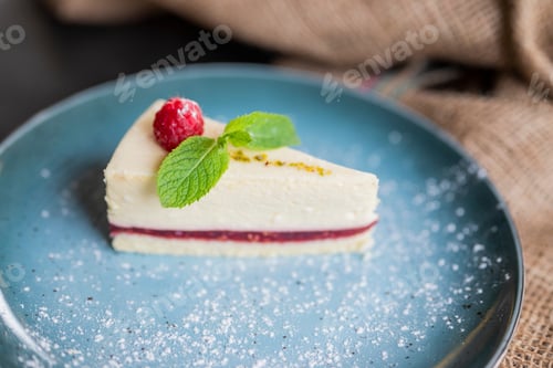 Preview: delicious dessert at the restaurant cheesecake with raspberries