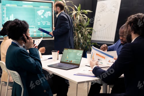 Preview: Team leader talking on call with the accountant to check stock trends progress