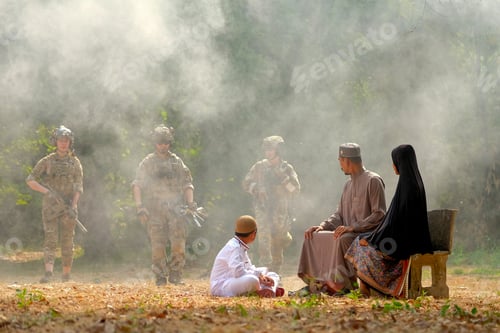 Preview: Muslim family look to group of soldier come from the jungle during the battle near the village