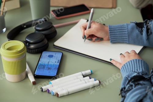 Preview: Engineer Drawing Blueprint On Paper