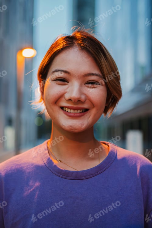 Preview: Vertical portrait of happy young asian lovely young woman standing outside enjoying the late night