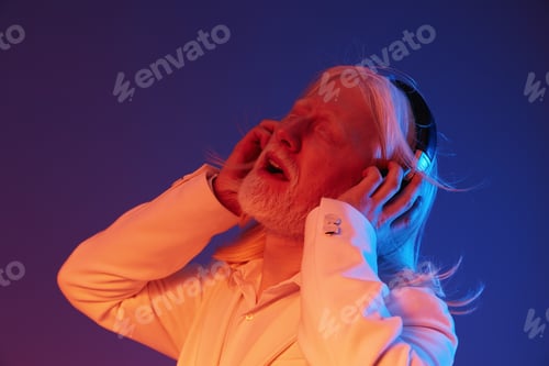 Preview: elderly man enjoying music, colorful lighting, blue and orange background, emotional expression